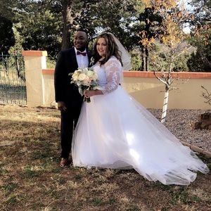 Wedding dress. Size 20. Can fit 22. Flattering.